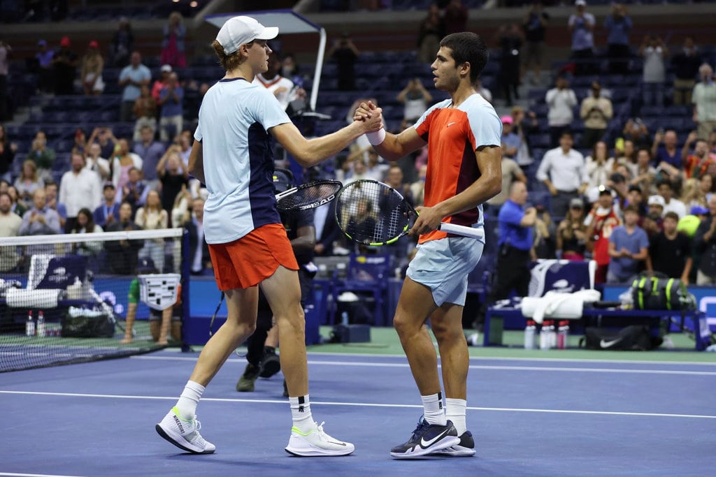 Carlos Alcaraz and Jannik Sinner shake hands after the quarterfinal at US Open