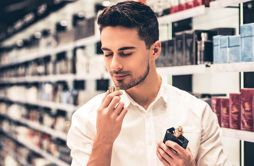 A man who's shopping around for the perfect cologne scent.