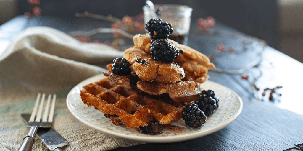 spicy gluten-free chicken and cheddar waffles with blackberry-maple syrup